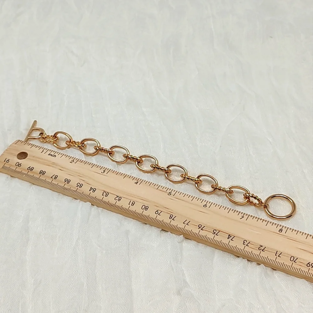 Gold tone oval chain link toggle bracelet